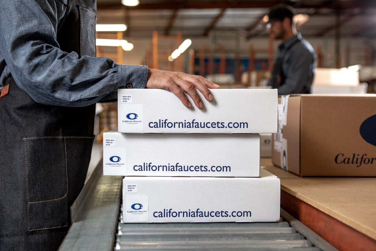 stack of California Faucets shipping boxes