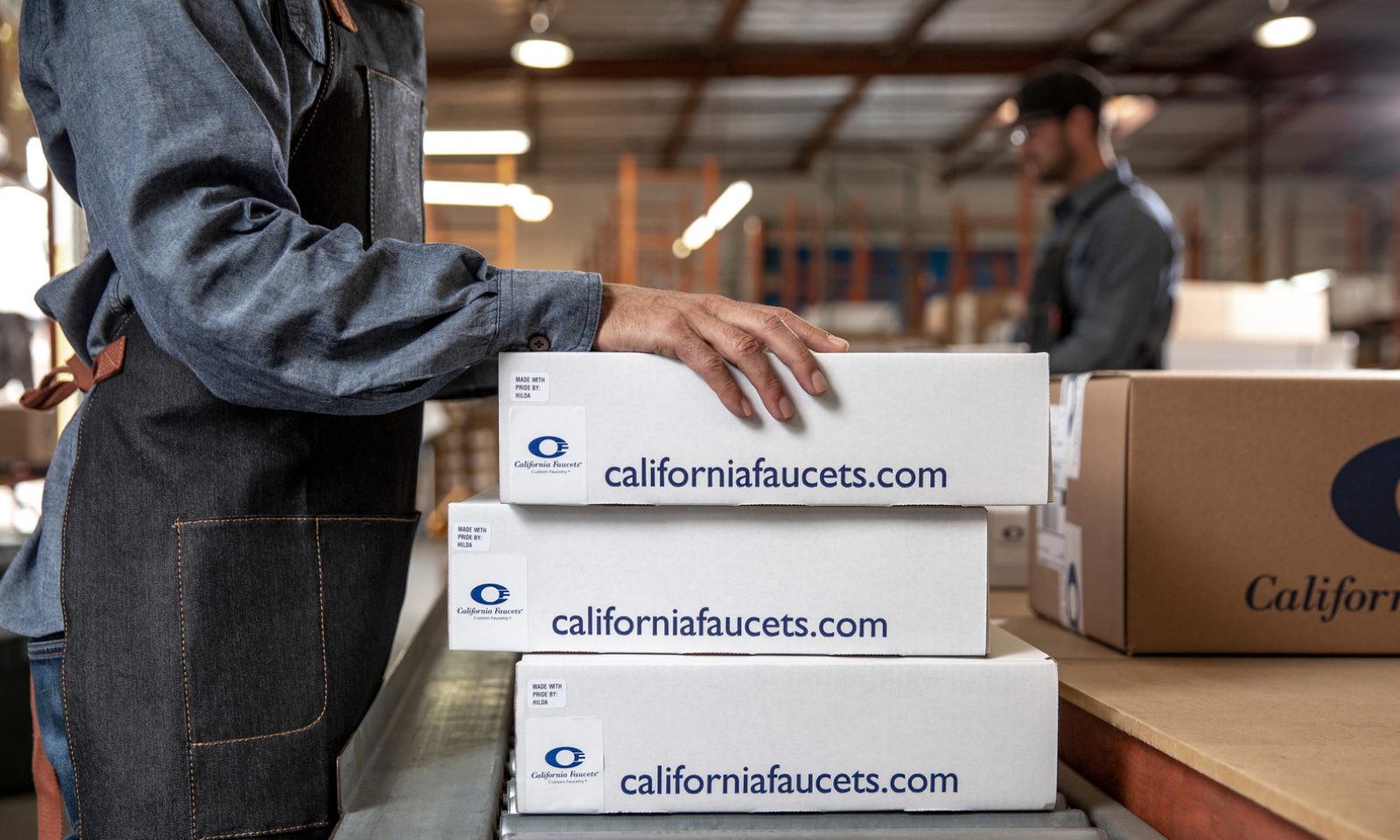stack of California Faucets shipping boxes